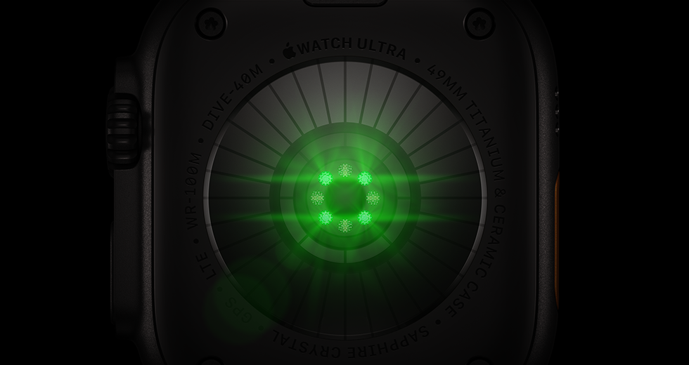 Dos de l’Apple Watch Ultra 4, boîtier en titane, noir, plusieurs capteurs ronds avec LED vertes allumées