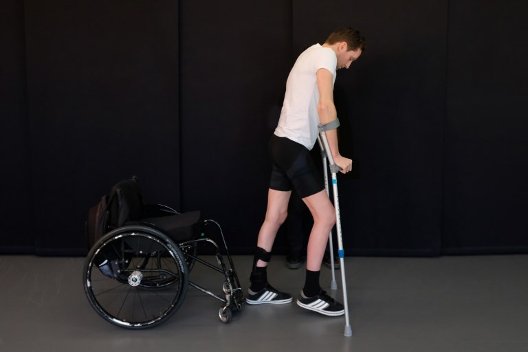 This handout photo released on October 31, 2018 by the Federal Polytechnique School of Lausanne (EPFL)/ The Lausanne University Hospital (CHUV) shows Gert-Jan Oskam, at the Lausanne University Hospital in April 2018. A breakthrough treatment involving electrical stimulation of the spine has enabled paralysed patients to walk again, apparently reactivating nerve connections and providing hope for people even years after accidents. EPFL / AFP